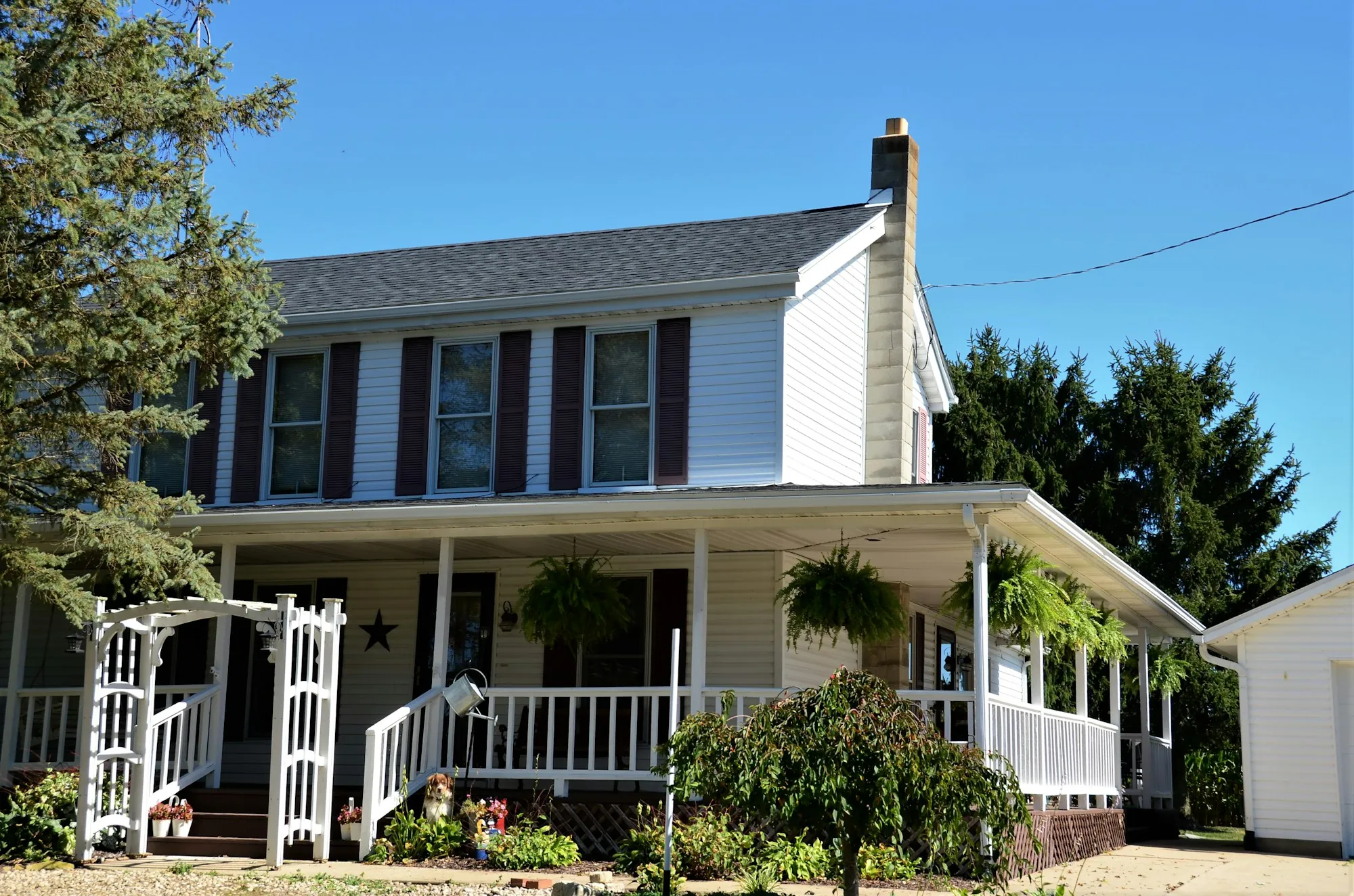 Two-story home with a wraparound front porch